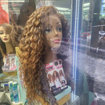 Optima Beauty Supply - A close up of a curly synthetic blend wig. Pre-plucked! - Cosmetics & Beauty Supply Near Me - New York, New York Optima Beauty Supply - A close up of a curly synthetic blend wig. Pre-plucked! - Cosmetics & Beauty Supply Near Me - New York, New York