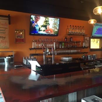 Mojo TaGo - a bar area with a television and bar stools - Food Trucks Near Me - Powell, Ohio Mojo TaGo - a bar area with a television and bar stools - Food Trucks Near Me - Powell, Ohio