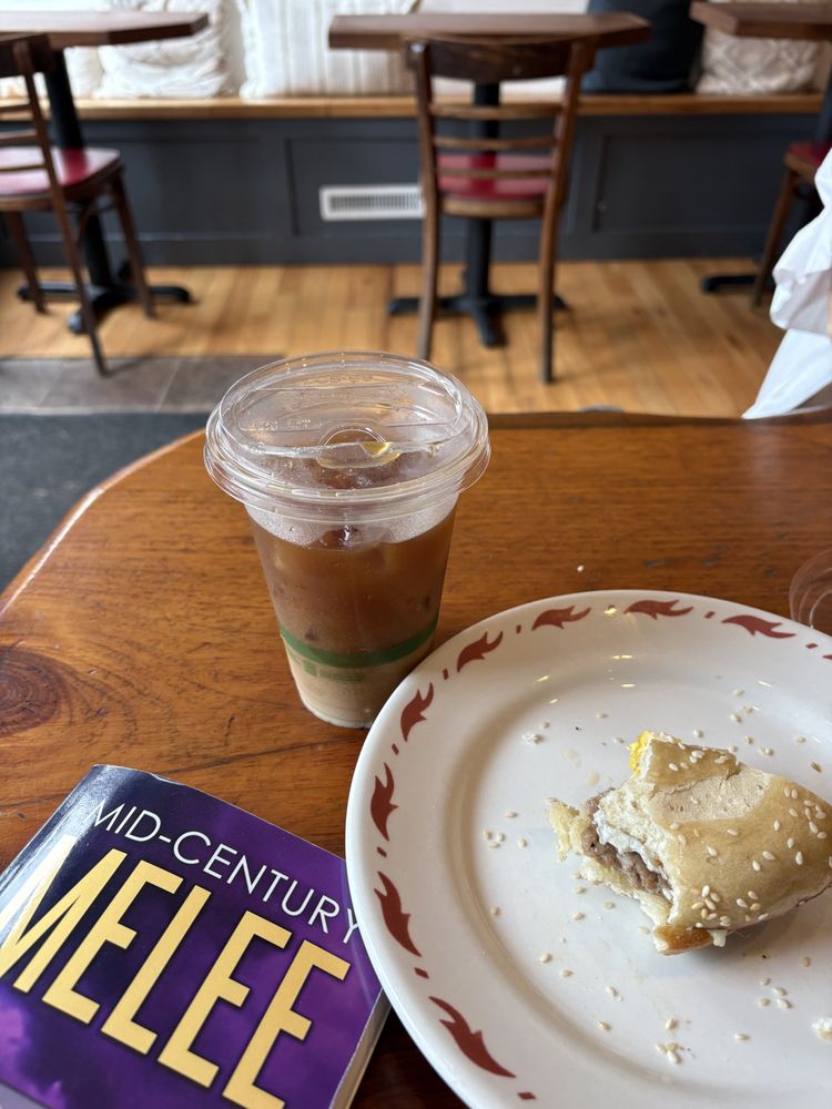 Shipwrecked Books, News & Cafe Logo