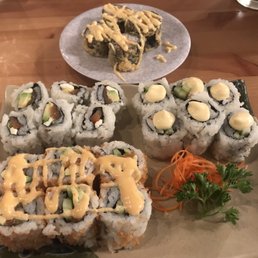 I believe Miami Roll in the background. Salmon Avocado Roll, Philly Roll, and Crunchy Spicy Salmon Roll. I believe Miami Roll in the background. Salmon Avocado Roll, Philly Roll, and Crunchy Spicy Salmon Roll.