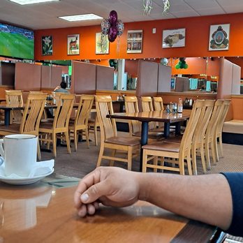 El Sazon K-Tracho #2 - ws a person sitting at a table with a cell phone in their hand - Honduran Near Me - Los Angeles, California El Sazon K-Tracho #2 - ws a person sitting at a table with a cell phone in their hand - Honduran Near Me - Los Angeles, California