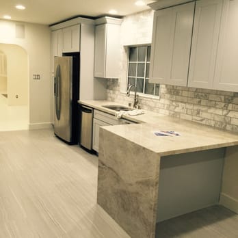 Stone Etc. - a kitchen with a marble island - General Contractors Near Me - Hayward, California