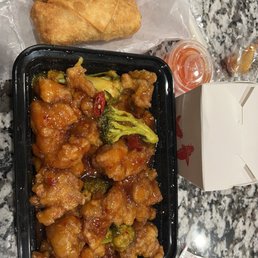 Egg Rolls Orange Chicken with white rice Egg Rolls Orange Chicken with white rice