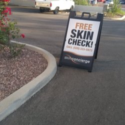 Skin Concierge - Sign in parking lot.