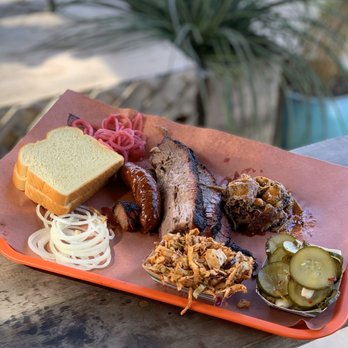 la Barbecue - One pound of brisket, one sausage, quarter pound of pulled pork, chipotle slaw, sliced pickles, onions, two slices of bread - Barbeque Near Me - Austin, Texas