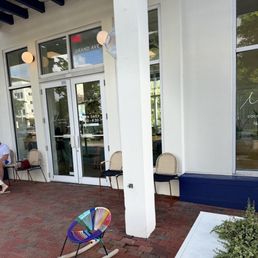Exterior outside entrance of Navi Coffee & Flowers - Elegant outside seating area - Miami, Florida Exterior outside entrance of Navi Coffee & Flowers - Elegant outside seating area - Miami, Florida