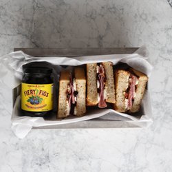 Jenkins Jellies Fiery Figs Pepper Jelly on a gourmet sandwich with Goat cheese.