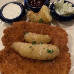 Pork Schnitzel and potatoes with Lingonberry jam, Ranch Dressing, and fresh Dill Cucumbers on the side.
