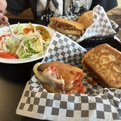 Russo's Pizza Family Restaurant - Salad on the left, steak sandwich in the back, meatball sub in the front.