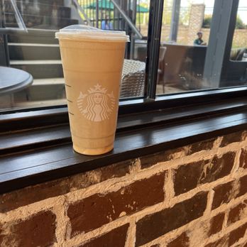 Starbucks - a cup of coffee sitting on a window sill - Coffee & Tea Near Me - Milton, Georgia Starbucks - a cup of coffee sitting on a window sill - Coffee & Tea Near Me - Milton, Georgia