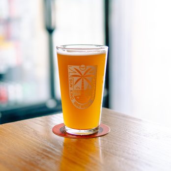 Sun King Sarasota - a glass of beer on a table - Brewpubs Near Me - Sarasota, Florida Sun King Sarasota - a glass of beer on a table - Brewpubs Near Me - Sarasota, Florida