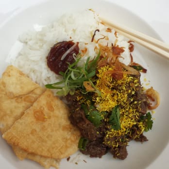 Sansho - The organic beef curry - strong taste of coconut.. The fried roti was delish. - Asian Fusion Near Me - Prague, Puerto Rico