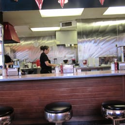 a woman preparing food in a restaurant
