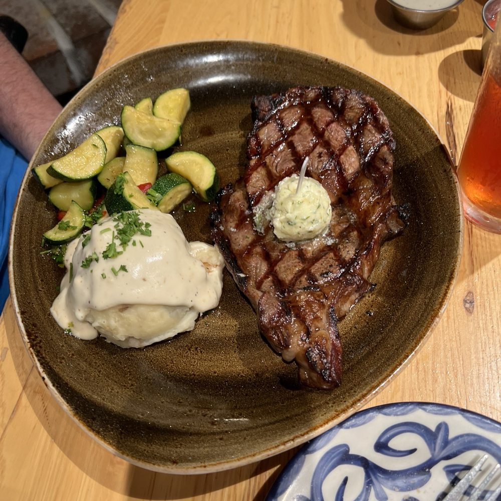 Black Oak Grill - My husband's ribeye with mashed potatoes and zucchini - American Near Me - Branson, Missouri