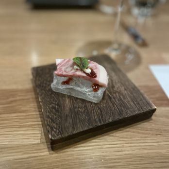 Ukiyo Omakase - a piece of food on a wooden board - Sushi Bars Near Me - Denver, Colorado Ukiyo Omakase - a piece of food on a wooden board - Sushi Bars Near Me - Denver, Colorado