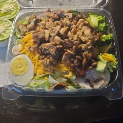 American Deli - Grilled Chicken Salad...I'm sure they'd hold the green peppers if your not a fan of.