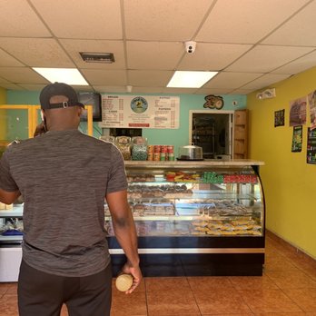 Island Style Caribbean Bakery - a man standing in front of the counter - Bakeries Near Me - West Palm Beach, Florida Island Style Caribbean Bakery - a man standing in front of the counter - Bakeries Near Me - West Palm Beach, Florida