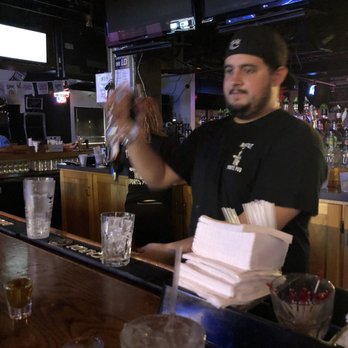 Time Out West - a bartender pouring a drink - Sports Bars Near Me - Hanover Park, Illinois Time Out West - a bartender pouring a drink - Sports Bars Near Me - Hanover Park, Illinois