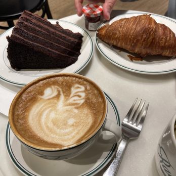 Ralph's Coffee - Chocolate cake, vanilla latte, plain croissant with strawberry jam - Coffee & Tea Near Me - New York, New York