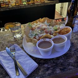 Monaghan's Bar and Grill - Beef Taco Salad with additional sides of Rice & Beans, Hatch Green Chili, & Sour Cream
