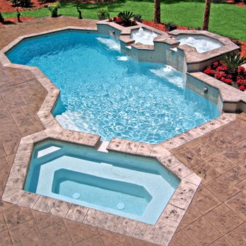 Blue Haven Pools & Spas - Geometric-shaped concrete pool with elevated enclosures of bubbler fountains, custom geometric spa, and lion-head water sconces - Hot Tub & Pool Near Me - Beaumont, Texas Blue Haven Pools & Spas - Geometric-shaped concrete pool with elevated enclosures of bubbler fountains, custom geometric spa, and lion-head water sconces - Hot Tub & Pool Near Me - Beaumont, Texas