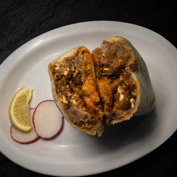 Fuego Cravings - A hearty breakfast burrito filled with beans, scrambled eggs, chorizo, and melted cheese, wrapped in a 13" flour tortilla. - Mexican Near Me - Covina, California Fuego Cravings - A hearty breakfast burrito filled with beans, scrambled eggs, chorizo, and melted cheese, wrapped in a 13" flour tortilla. - Mexican Near Me - Covina, California