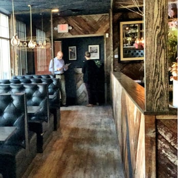 Branca - Photo taken from the bar. Walking in, booths will be on the right and dining room to left. - Cocktail Bars Near Me - Pittsford, New York Branca - Photo taken from the bar. Walking in, booths will be on the right and dining room to left. - Cocktail Bars Near Me - Pittsford, New York