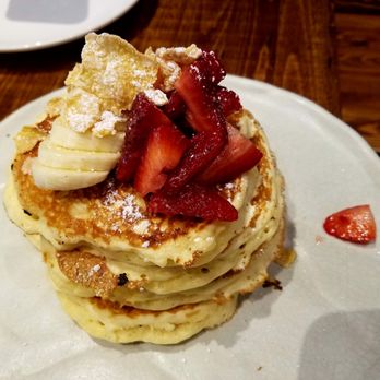 Scratch Kitchen - Close up of the - "Milk & Cereal" Pancakes ($11.00) - Bananas, Berries, "Milk" Syrup. - Breakfast & Brunch Near Me - Honolulu, Hawaii