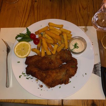 Restaurant Freiburger-Falle - Believe it or not this is half (yes half)of the schnitzel   or what they call elephant ears. Non greasy and real veal. Just amazing - Hotels & Travel Near Me - Murten, FR