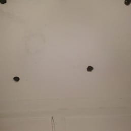 wholes in ceiling located in closet that doesnt have a door.  windows non locking. this isnt the worst of it!