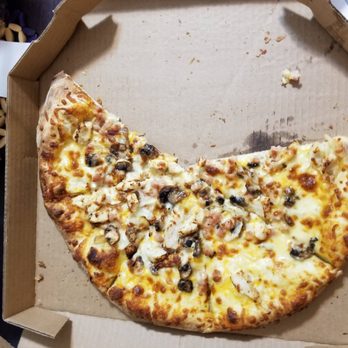 Domino's Pizza - a half eaten pizza in a box - Pizza Near Me - Vancouver, British Columbia