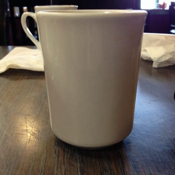 Manitoulin Espresso Bar - a coffee cup on a table - Coffee & Tea Near Me - Mindemoya, Ontario
