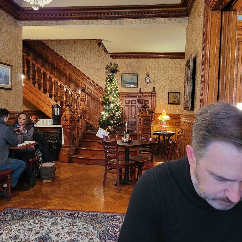 Iron Gate Cafe - Stairs w/ a Christmas tree - Cafes Near Me - Albany, New York