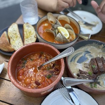 Leitao - Malandrinho (Soupy Rice) Bife a Cervejeiro (Sirloin Steak in Garlic Sauce) Ameijoas em Caldeirada (Littleneck Clams) - Portuguese Near Me - New York, New York Leitao - Malandrinho (Soupy Rice) Bife a Cervejeiro (Sirloin Steak in Garlic Sauce) Ameijoas em Caldeirada (Littleneck Clams) - Portuguese Near Me - New York, New York