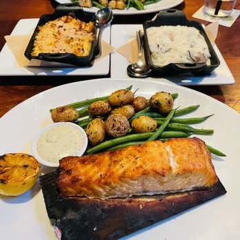 Seasons 52 - Salmon entree, crab polenta to the left and truffle risotto to the right - New American Near Me - Orlando, Florida