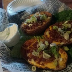 TJ O'Brien's Bar & Grill - Three huge potato skins. Very delicious!