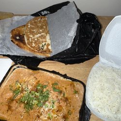 Indian Food Point & Wings Pizza - Butter Chicken Curry (of cashew nut sauce) with Rice.