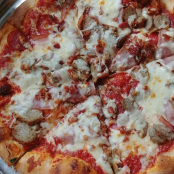 Moon River Pizza - Large T-Rex - Pizza Near Me - Jacksonville, Florida Moon River Pizza - Large T-Rex - Pizza Near Me - Jacksonville, Florida