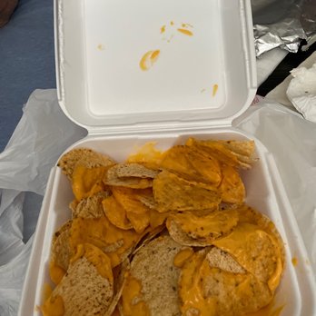 Tacos Boys - a container of chips and cheese - Food Trucks Near Me - Clovis, California