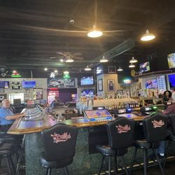 Bully's Sports Bar and Grill - A large and really cool sports bar with machines for gambling and so so so many TV's for sports events. Julie A