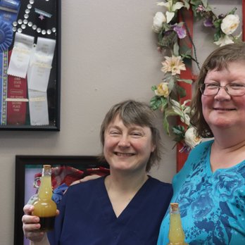 Anything Sweet & More Cafe - The chef and owner, on the left, standing beside her many ribbons from State Fairs etc., and holding her superb salad dressing!  Yum! - Sandwiches Near Me - Winterset, Iowa