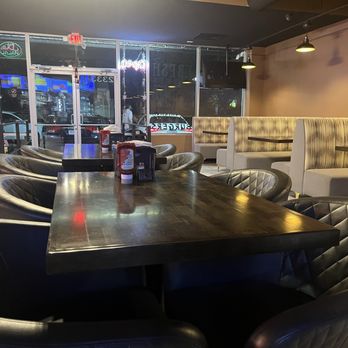 Peri Peri Original - The seating is a mix of a lounge and a sitdown restaurant. - Salad Near Me - Arlington, Virginia