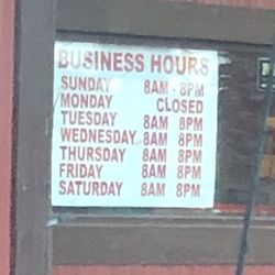 Strickland's Restaurant - Hour sign on the front. These are their summer hours apparently.