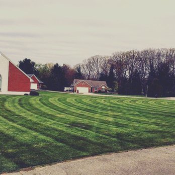 Action Lawncare and Snowplowing - a red house and a green lawn - Snow Removal Near Me Action Lawncare and Snowplowing - a red house and a green lawn - Snow Removal Near Me