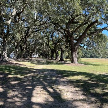 McLeod Plantation Historic Site - View from the enslaved's cabins to the Big House - Landmarks & Historical Buildings Near Me - Charleston, South Carolina McLeod Plantation Historic Site - View from the enslaved's cabins to the Big House - Landmarks & Historical Buildings Near Me - Charleston, South Carolina