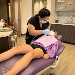 Encinitas Pediatric Dentistry - Watching a movie while getting her teeth cleaned- win/win!