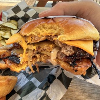Blackwood BBQ - Heavy on the onions and a light crust on the smashburger - Barbeque Near Me - Oak Brook, Illinois