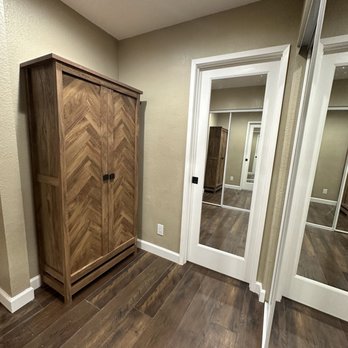 Valley Boutique Builders - AFTER New linen cabinet that replaced extra sink/vanity outside bathroom and new mirrored pocket door to bathroom in closed position. - General Contractors Near Me - Los Altos, California Valley Boutique Builders - AFTER New linen cabinet that replaced extra sink/vanity outside bathroom and new mirrored pocket door to bathroom in closed position. - General Contractors Near Me - Los Altos, California