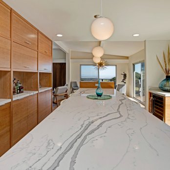Whitfield Construction - a kitchen with a marble countertop - General Contractors Near Me - Santa Rosa, California