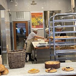 Goguette Bread - Picture of the bakers hurt at work, making additional baked bread for the afternoon.